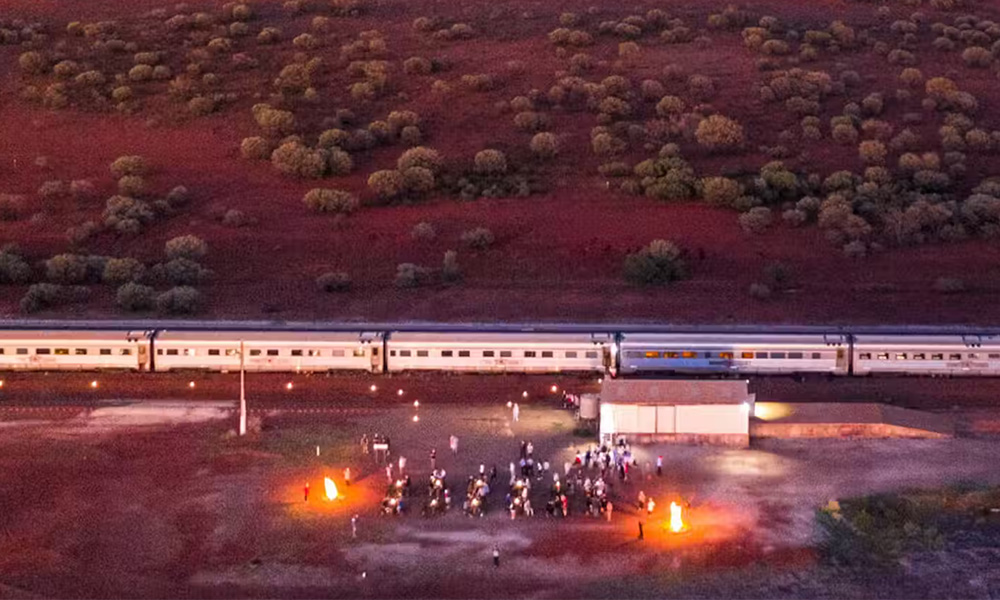 Jump off The Ghan at Marla to watch the sunrise over the outback